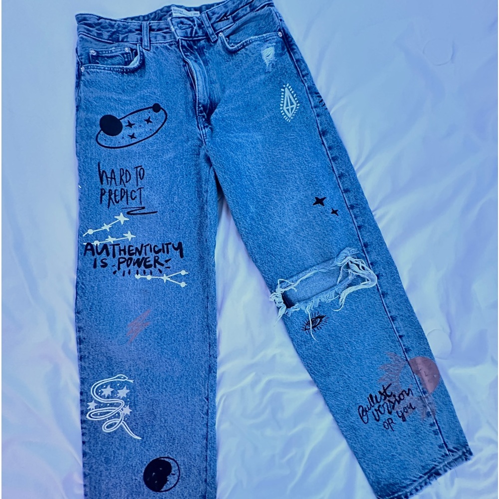 blue jeans with printed designs